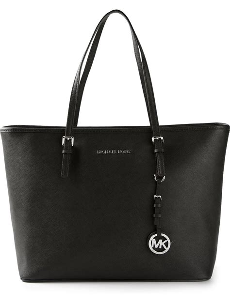 michael kors purses with mk logo black and white|Michael Kors black tote handbag.